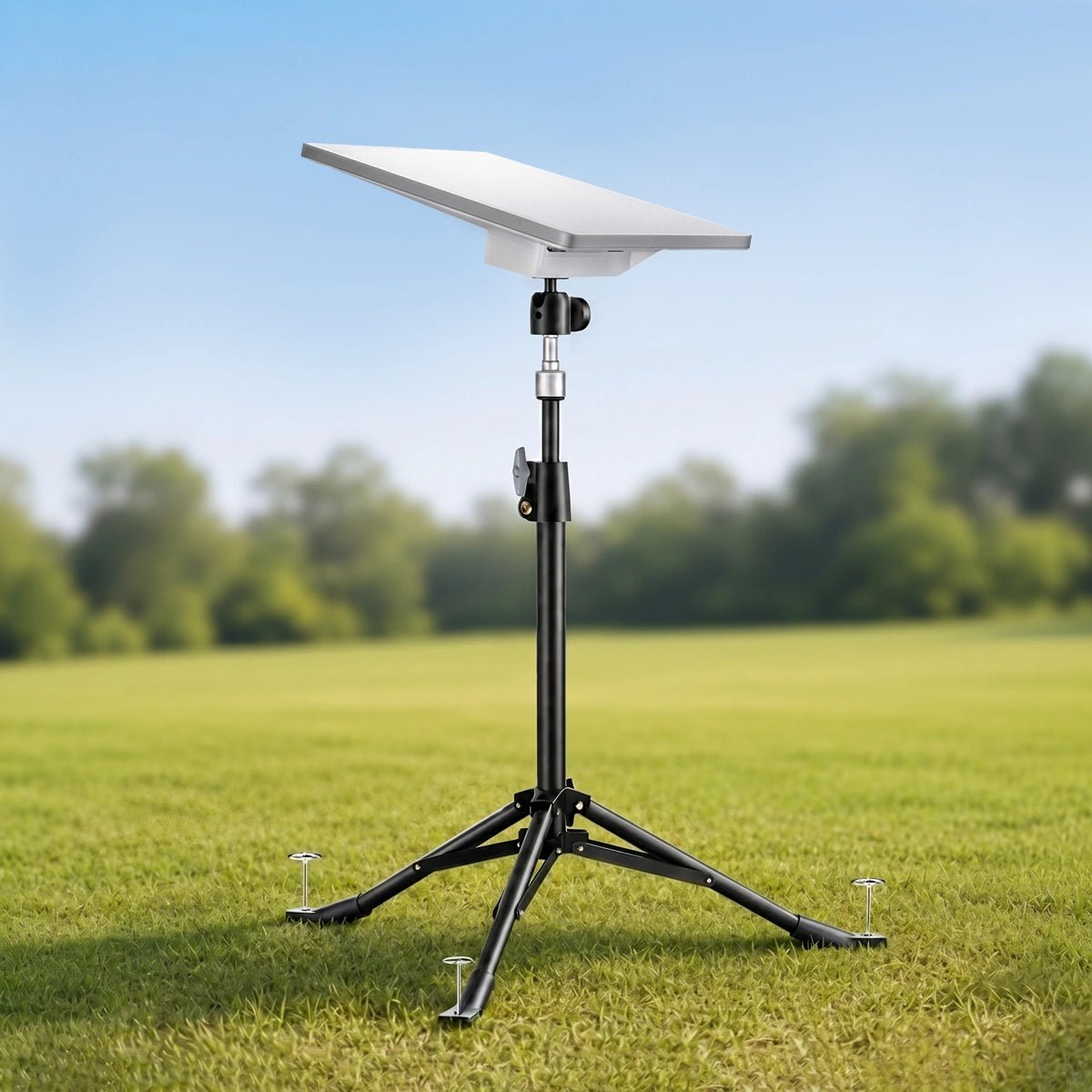 Tripod mount for Starlink set up on grassy field