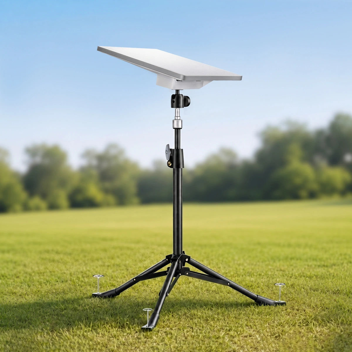 Tripod mount for Starlink set up on grassy field